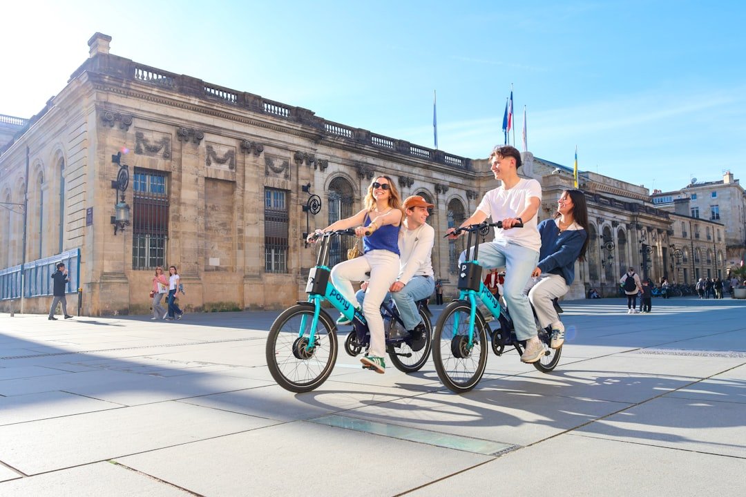 Four people enjoy a bike ride in the city.